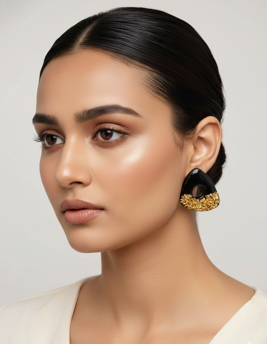 Glossy black clay earrings with gold stone detailing