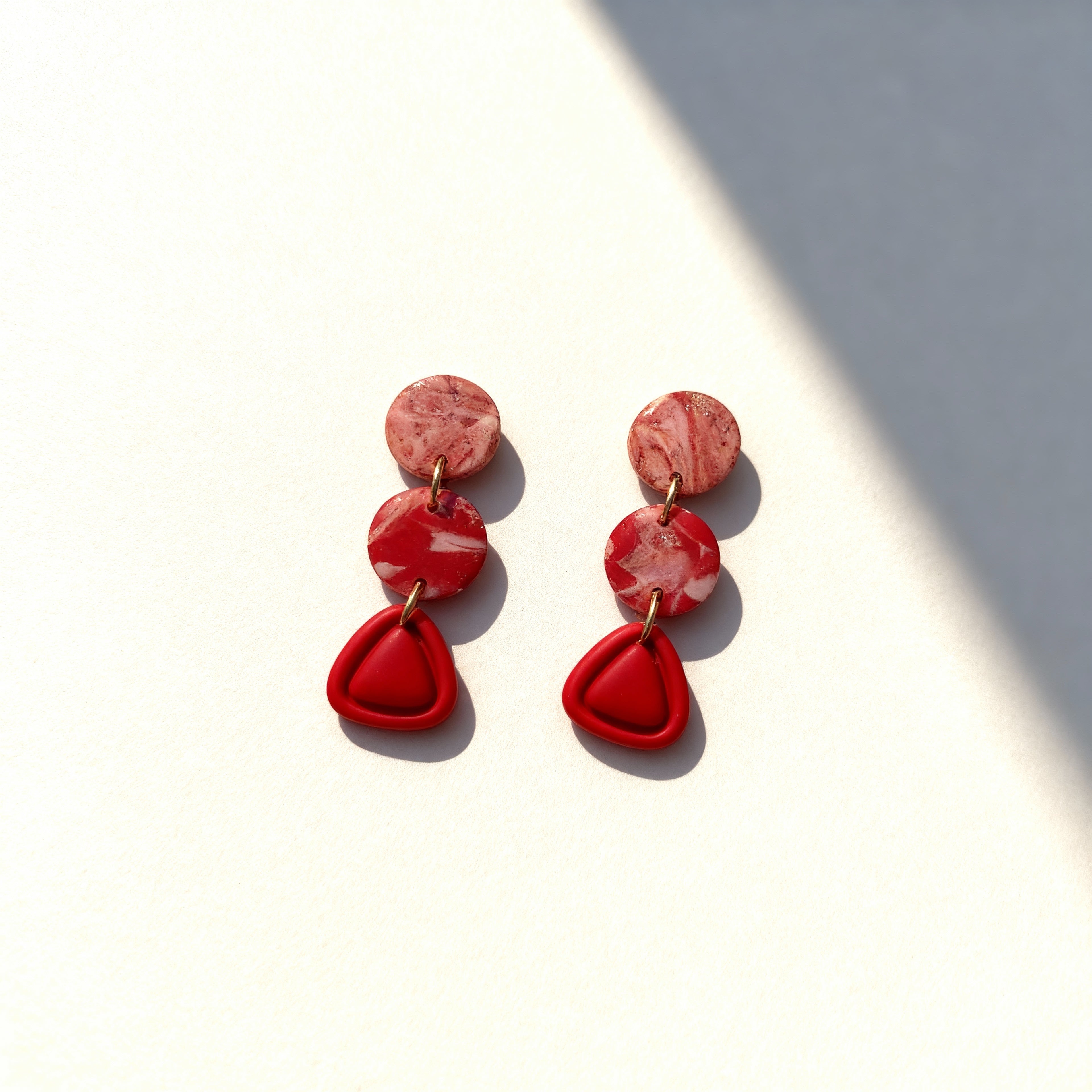 Handmade red marble clay triple drop earrings with geometric design